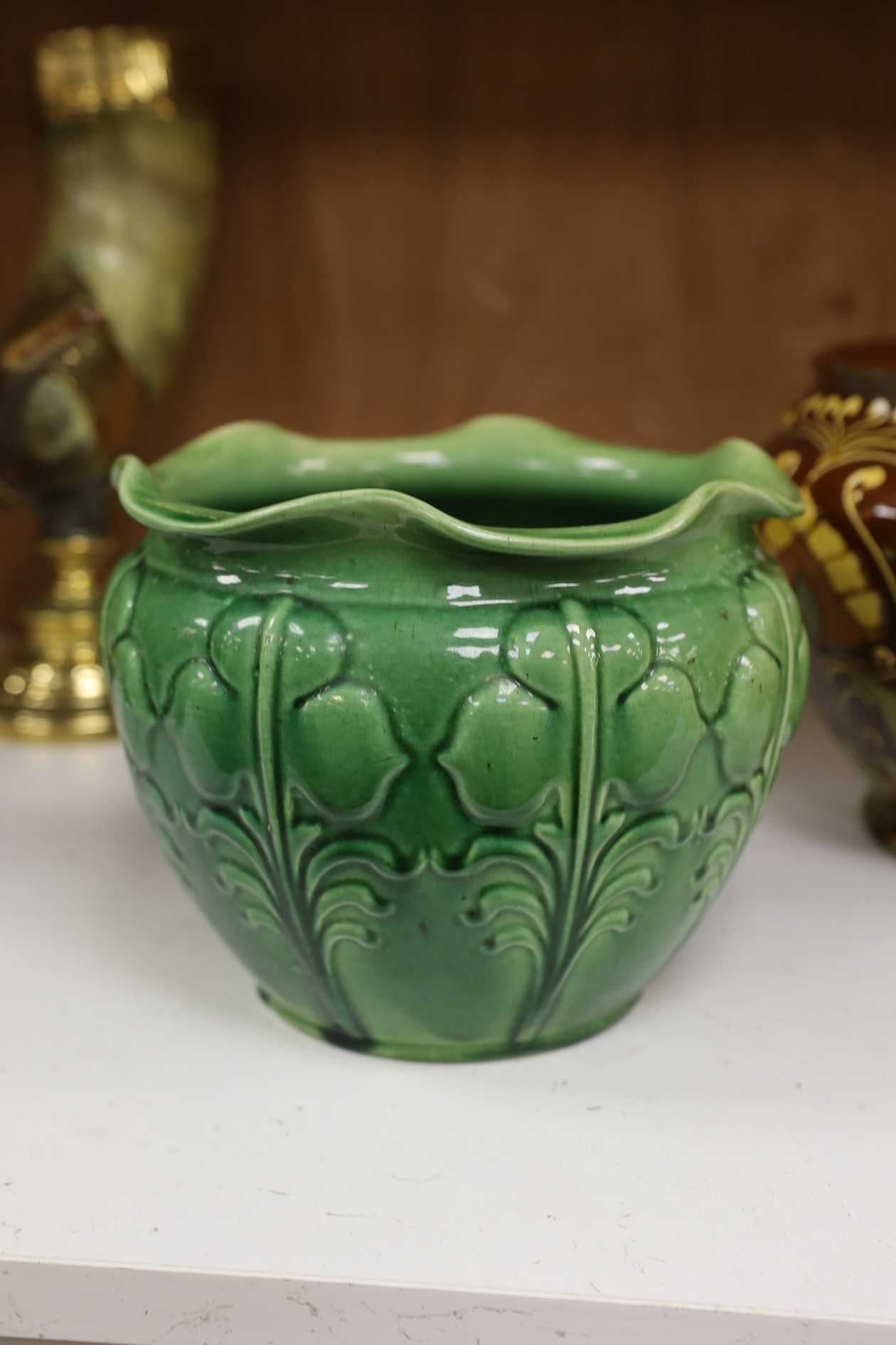 A Wardle decorative Arts and Crafts pottery jardiniere together with a green glazed jardiniere (2). Condition - fair